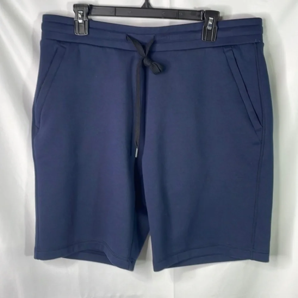 32°. Navy blue knit shorts.